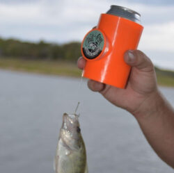 Orange Chill n reel drink holder fishing line with a caught fish.